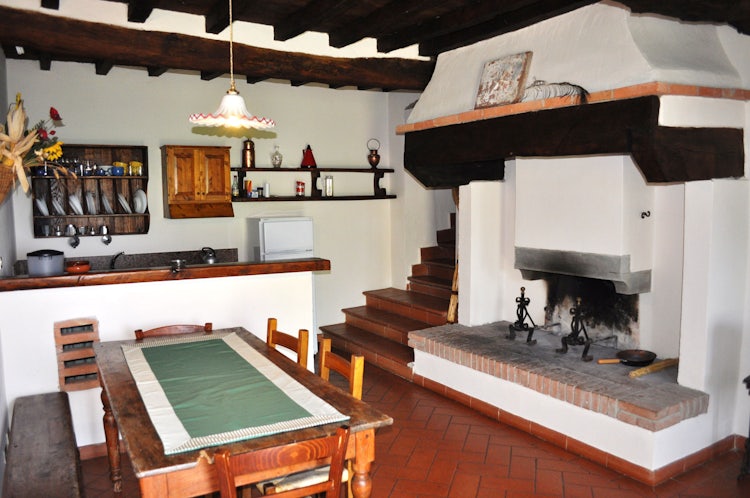 Kitchen with fireplace at I Nidi di Belforte