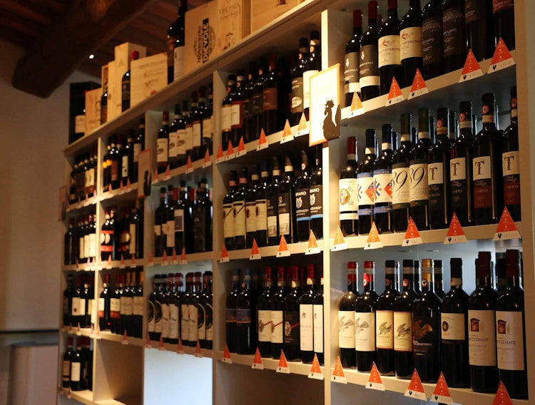 Shopping for wine at a duty free shop at the airport in Tuscany